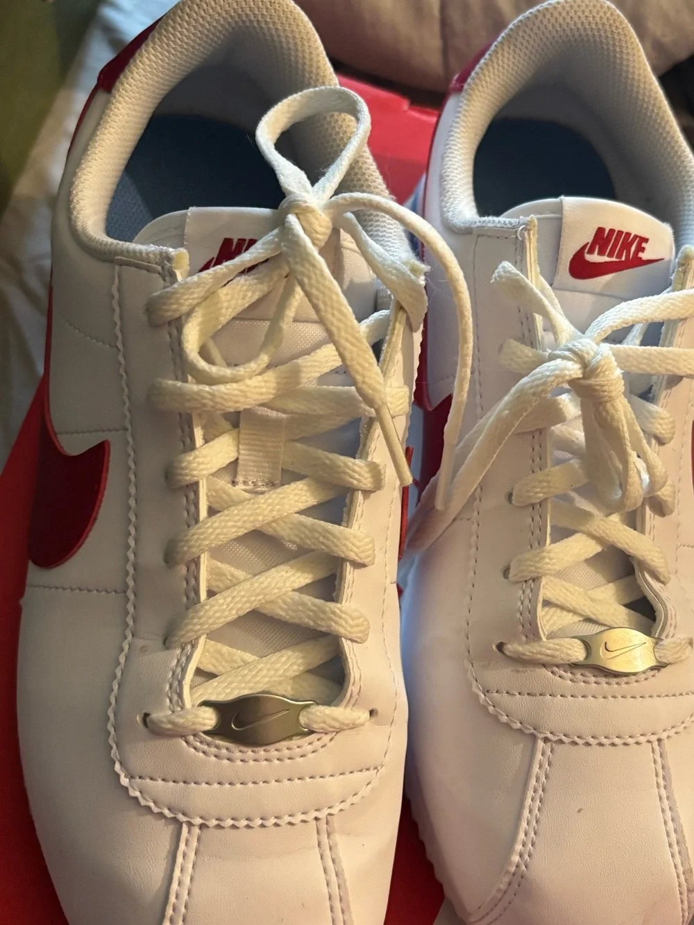 Nike Kids White Sneakers with Red Swoosh